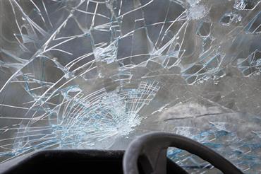 A broken windshield in a car