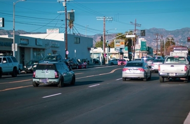 Cars driving down a street