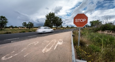 A car driving past a stop sign